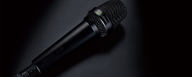This image shows the MTP 550 DM live performance microphone on black background